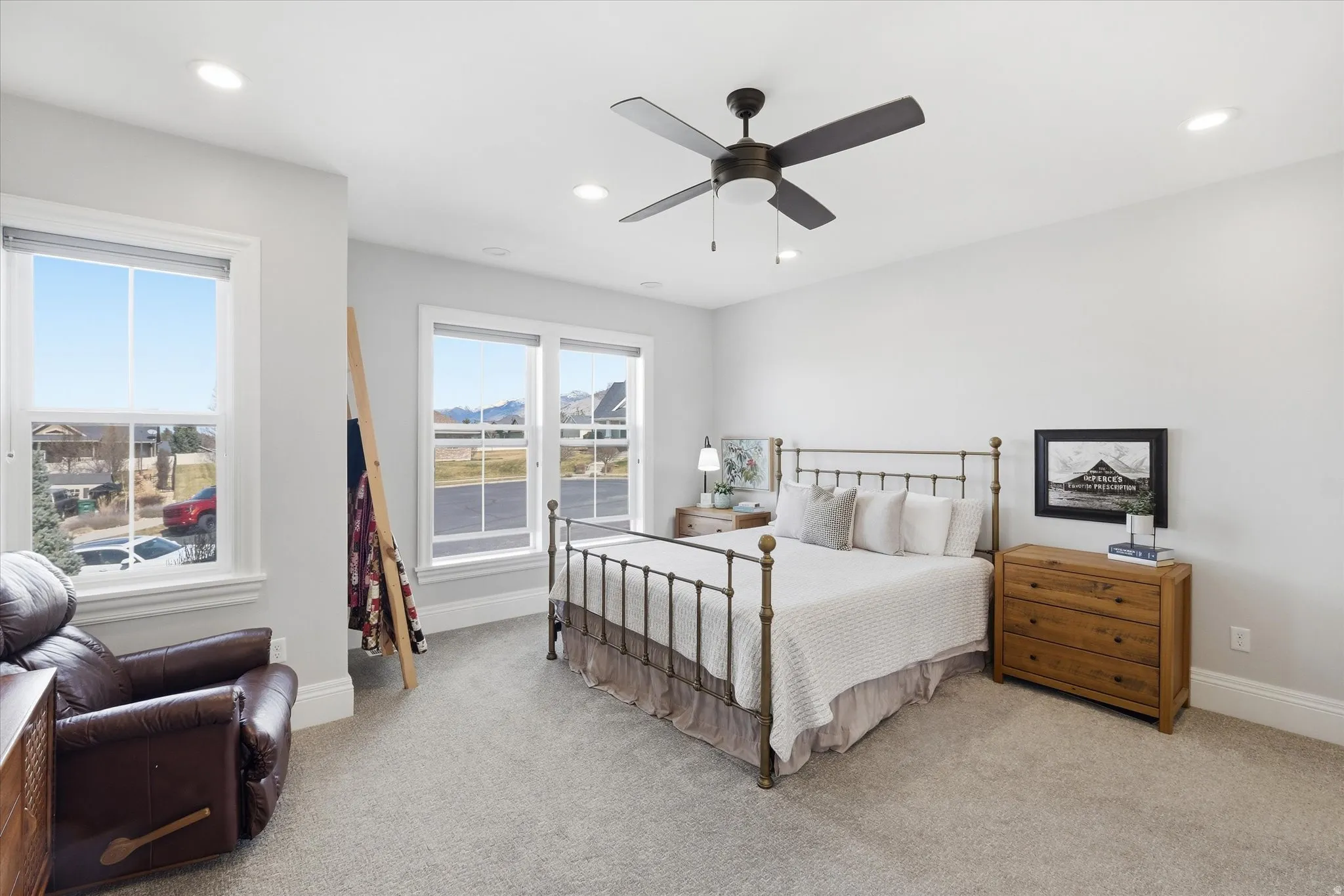 Bedroom featuring a ceiling fan, light colored carpet, and recessed lighting