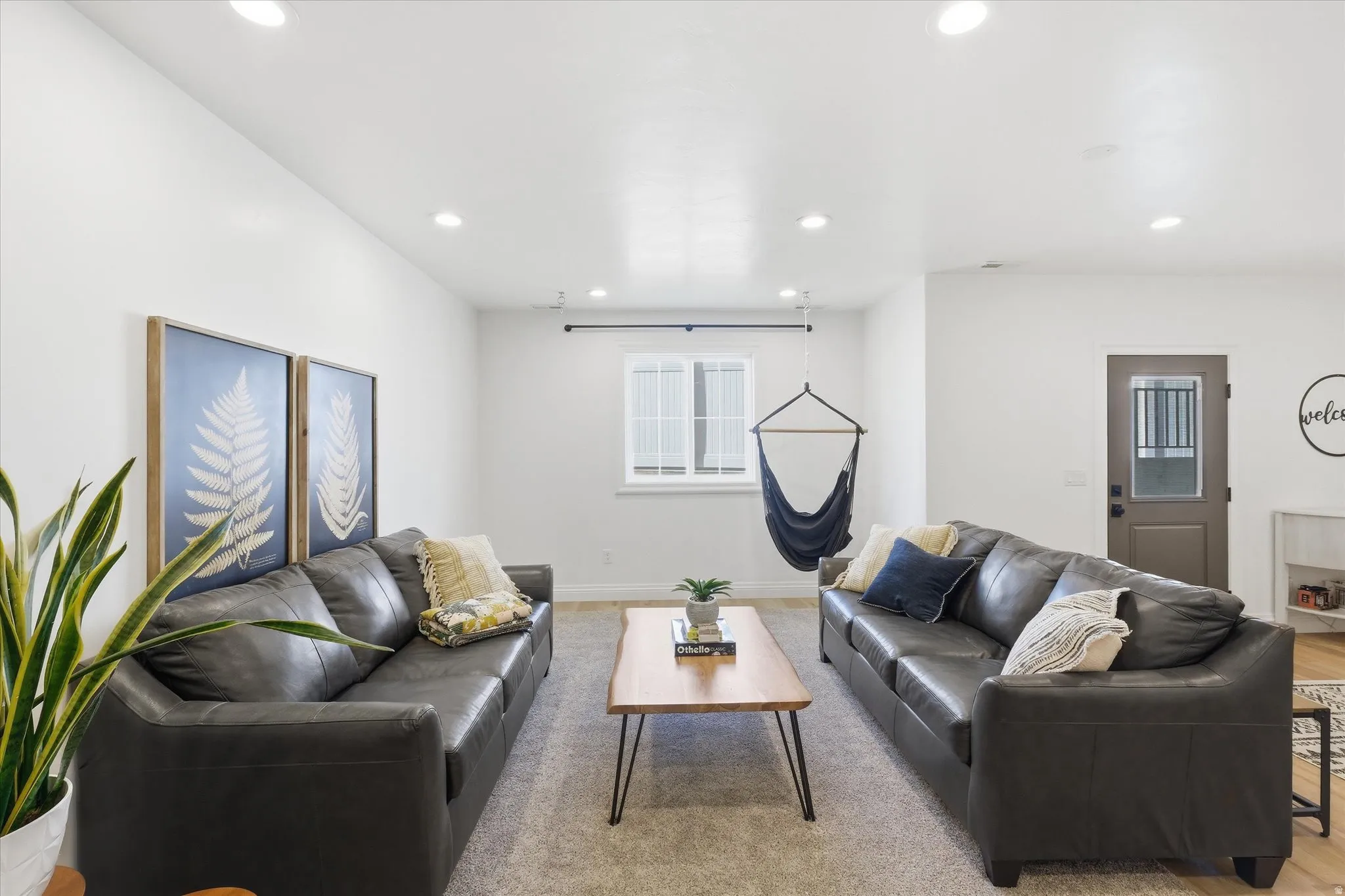 Living room featuring recessed lighting and light wood-style flooring