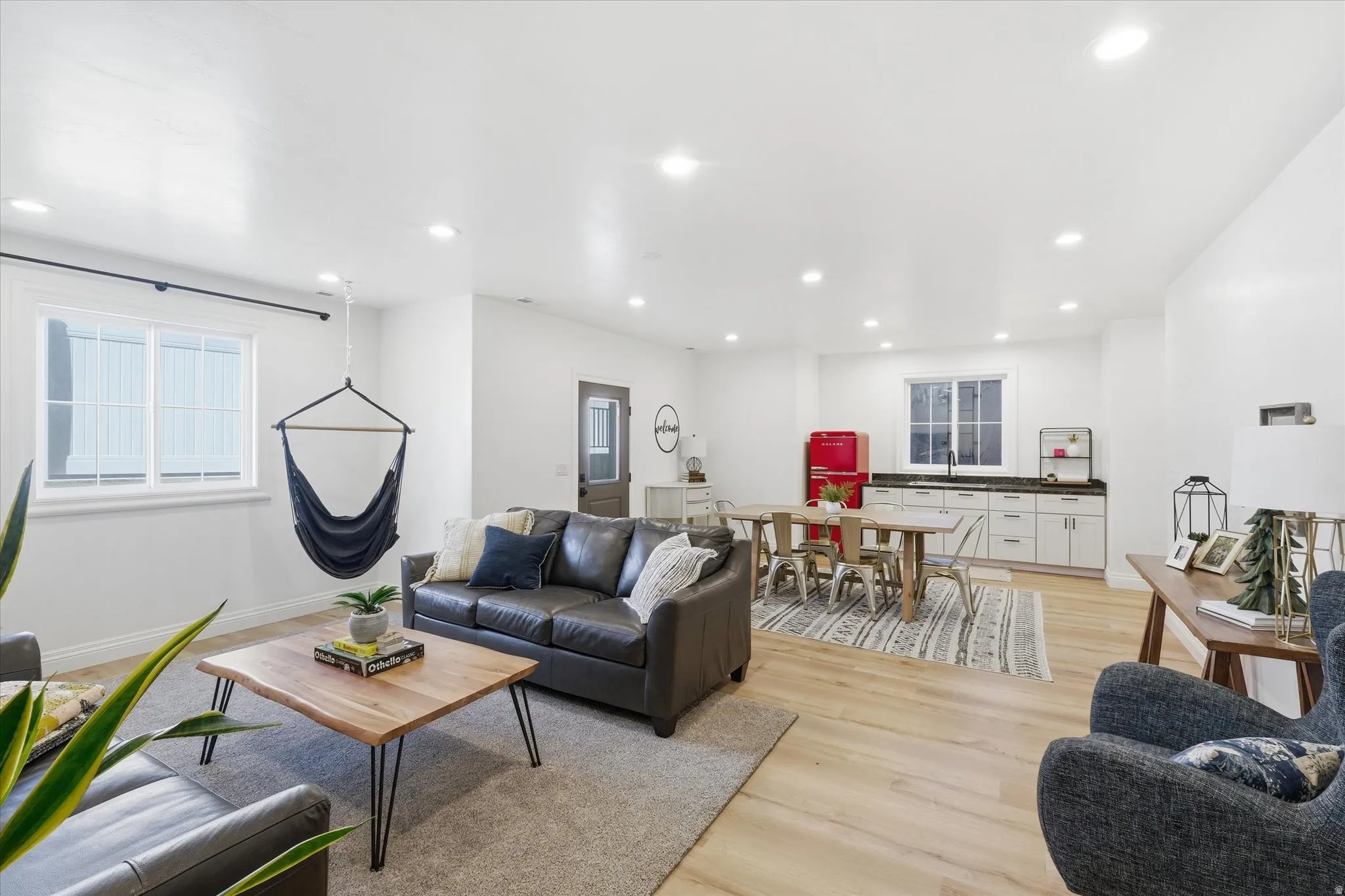 Living room featuring light wood-type flooring and recessed lighting