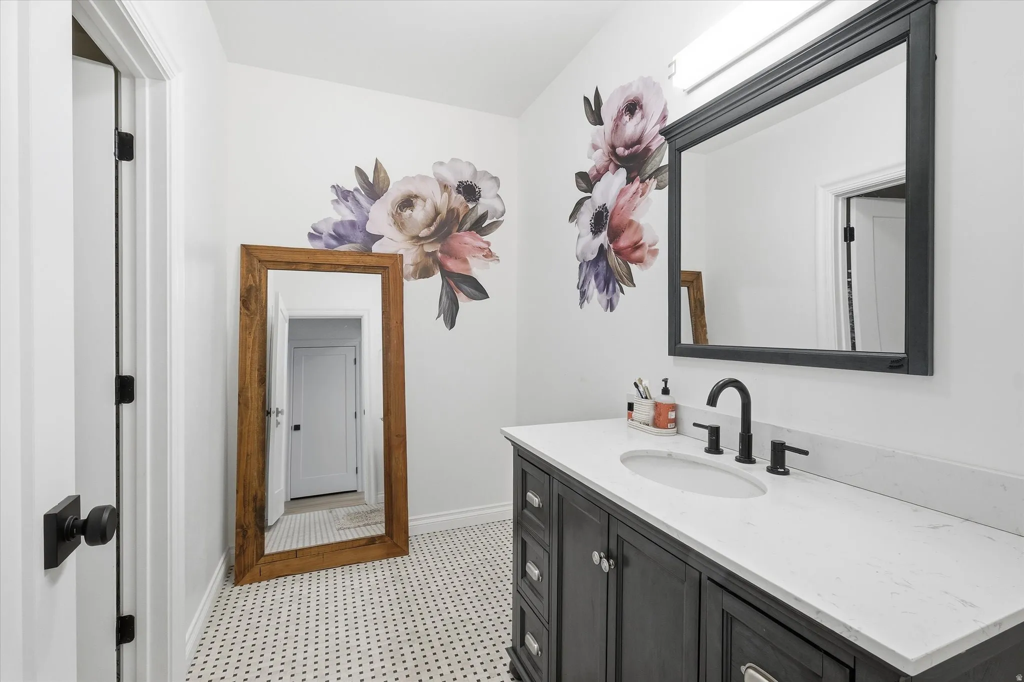 Bathroom with vanity and baseboards
