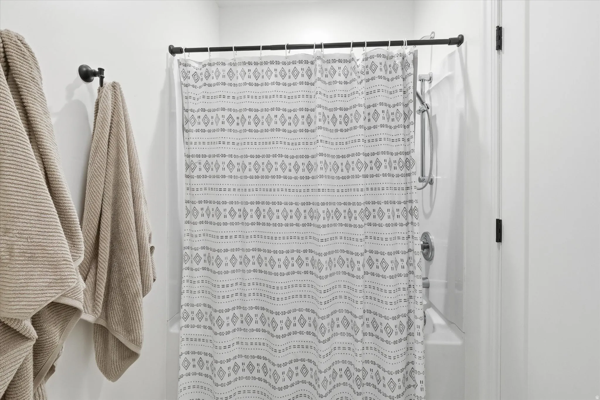 Full bath featuring curtained shower