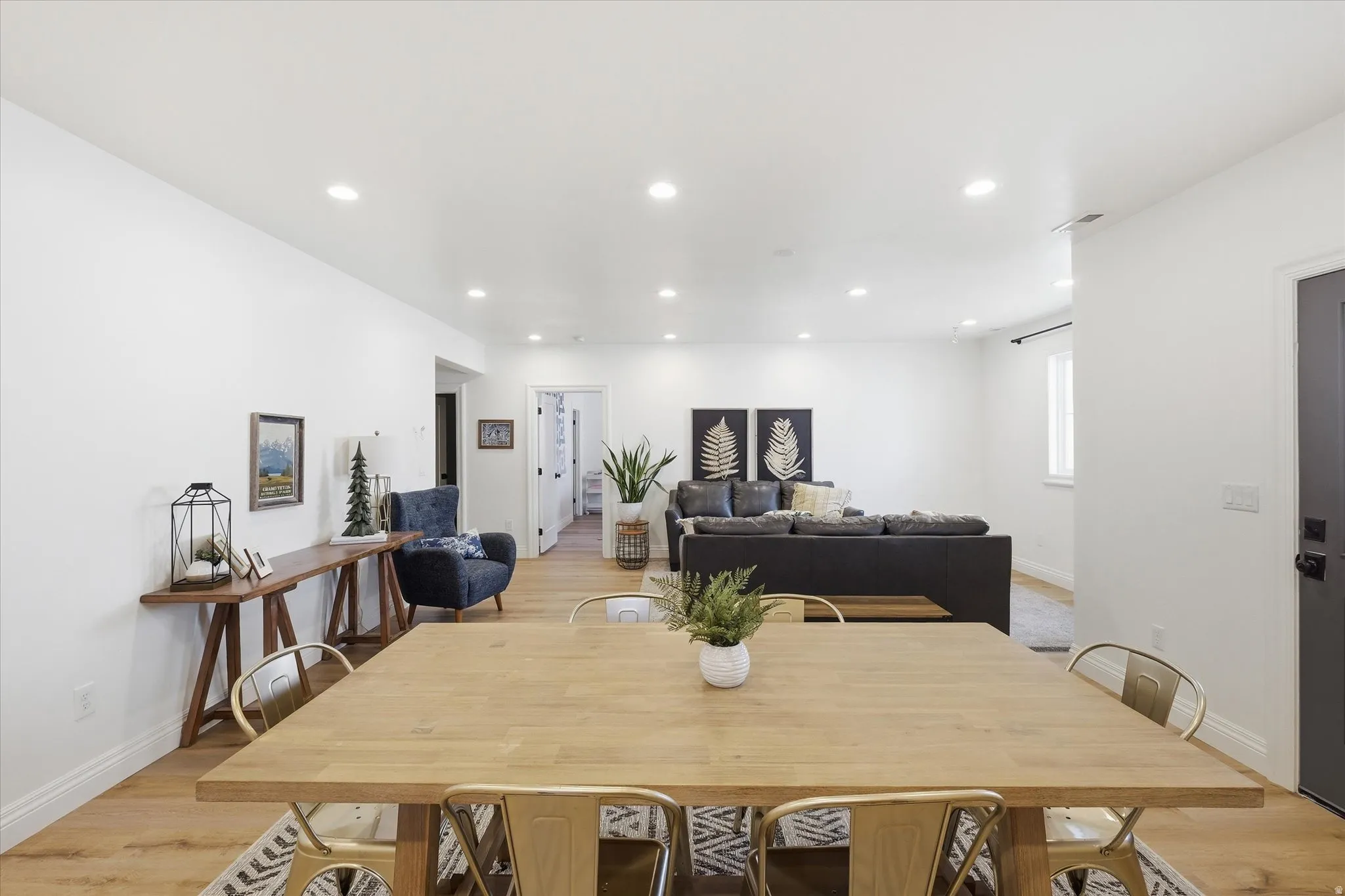 Dining space featuring light wood finished floors and recessed lighting