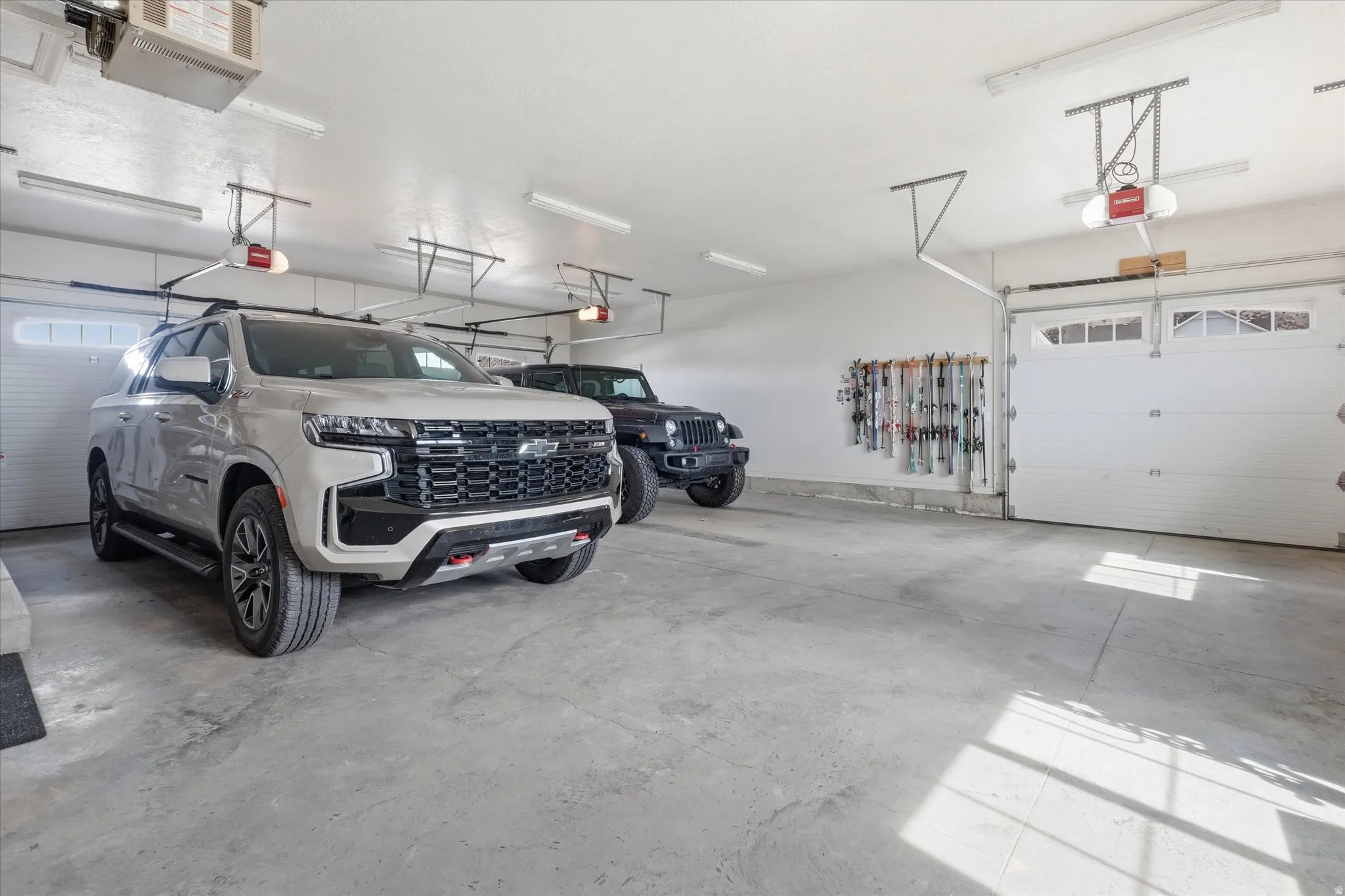 Garage with a heating unit and a garage door opener including 3 garage doors
