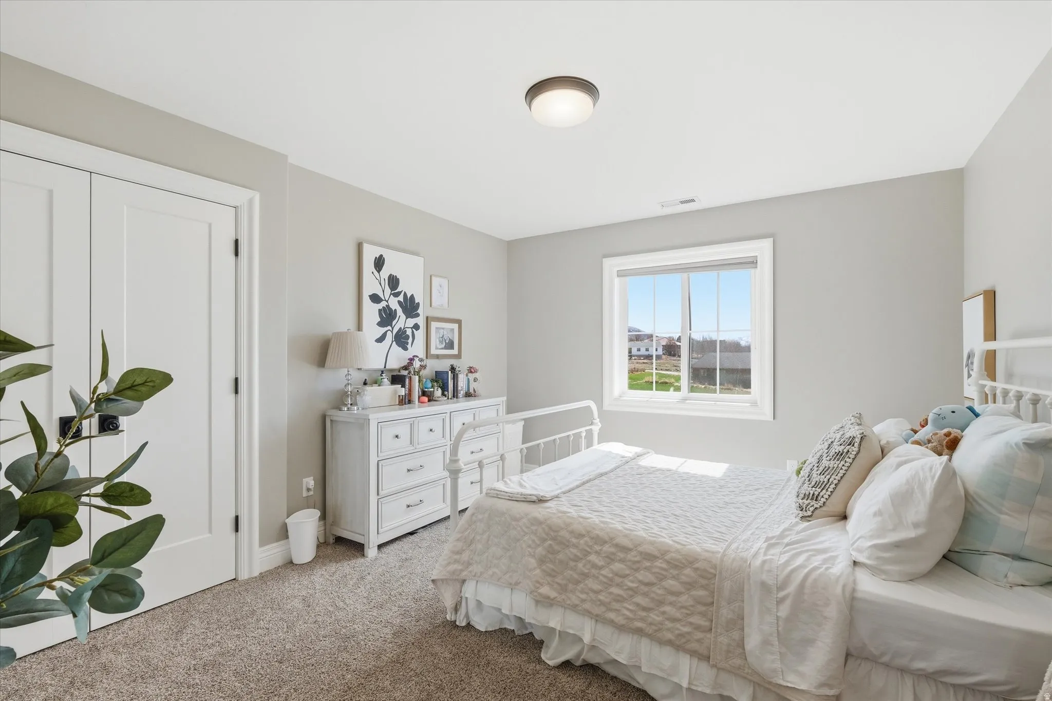 Bedroom with light carpet and baseboards, perfect size
