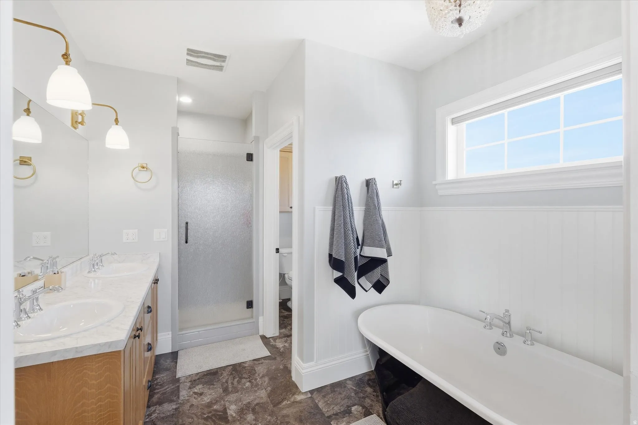 Double sink vanity, Beautiful cozy soaking tub, huge walk in shower, and private toilet closet
