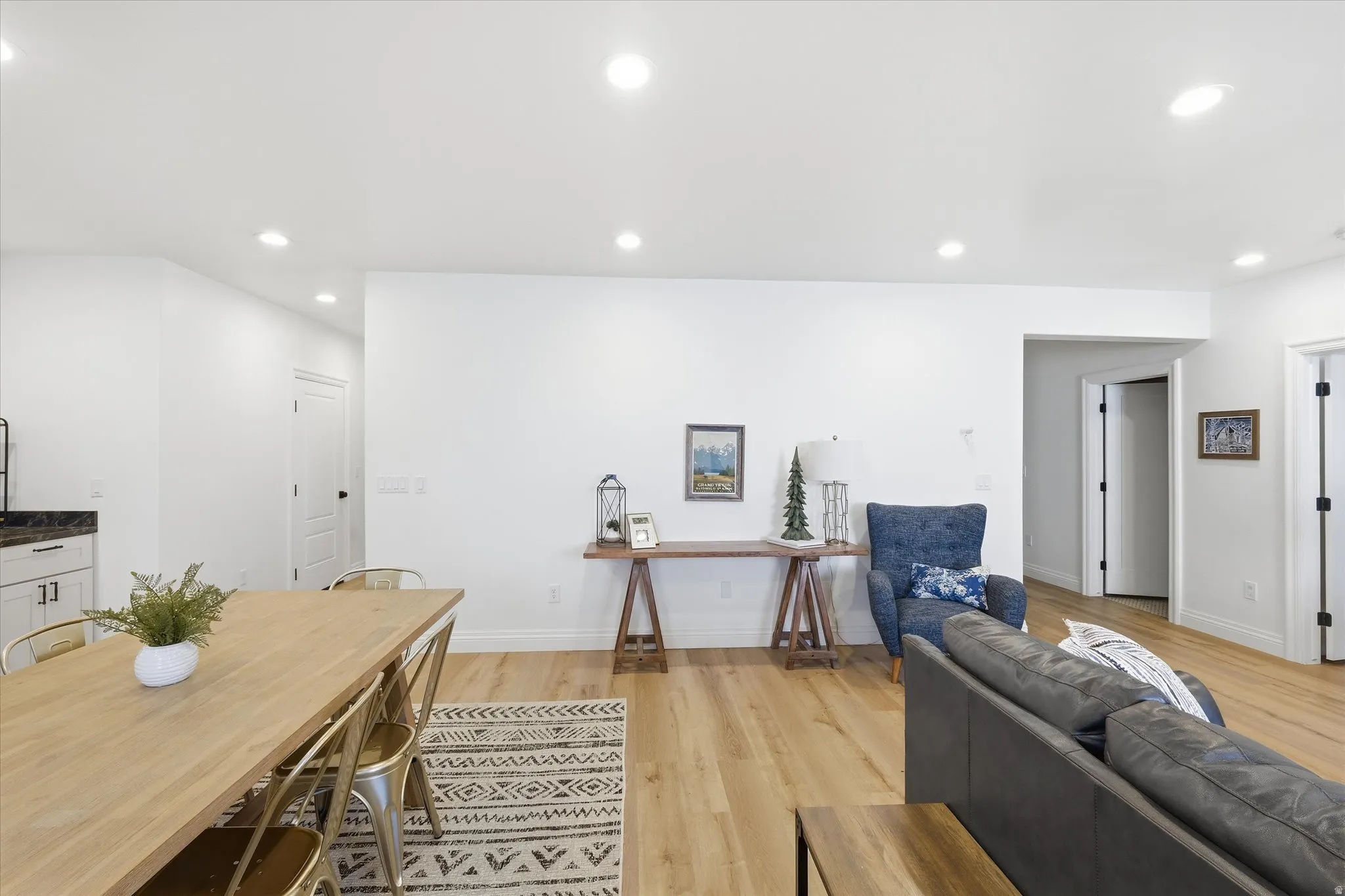 Living room featuring light wood-type flooring and recessed lighting