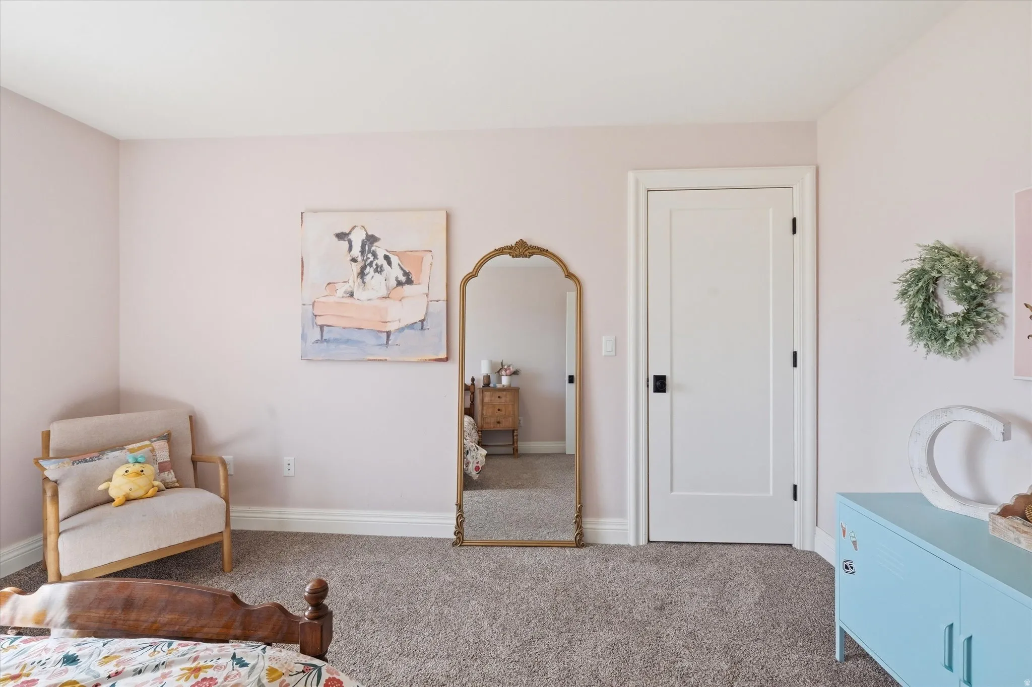 Bedroom with carpet floors and baseboards