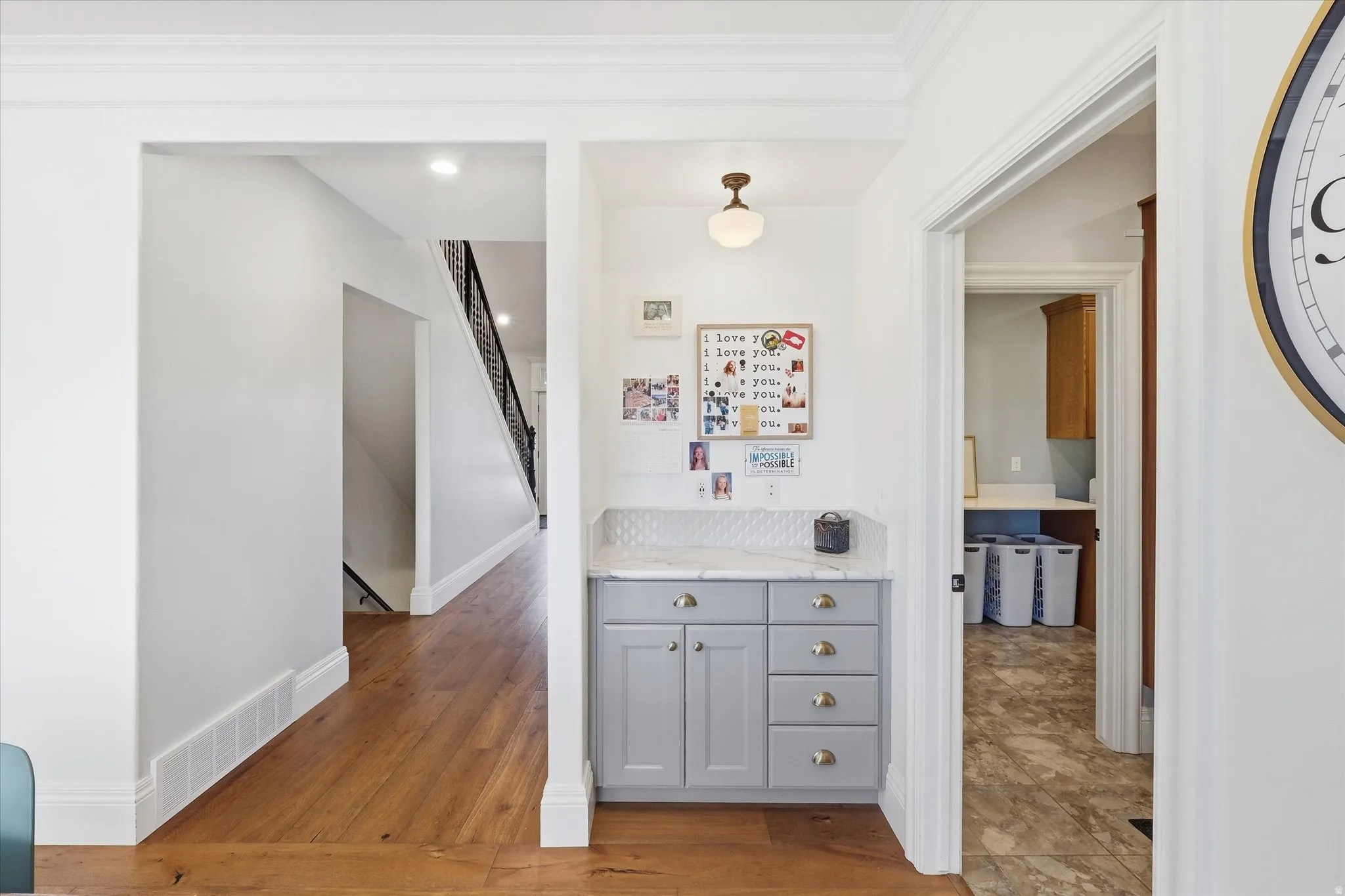Hallway featuring light wood-style flooring and baseboards