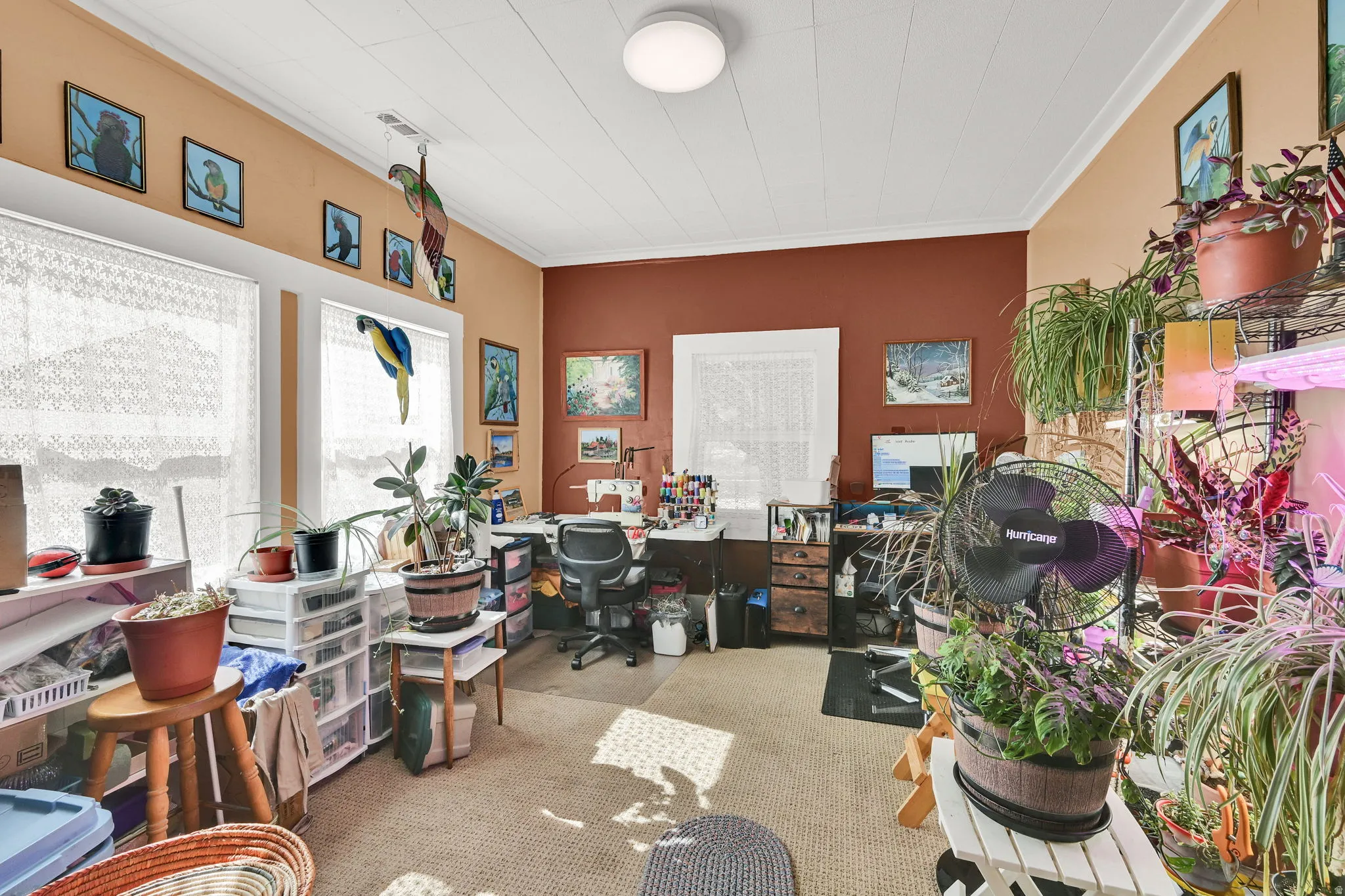 Home office featuring light carpet and crown molding