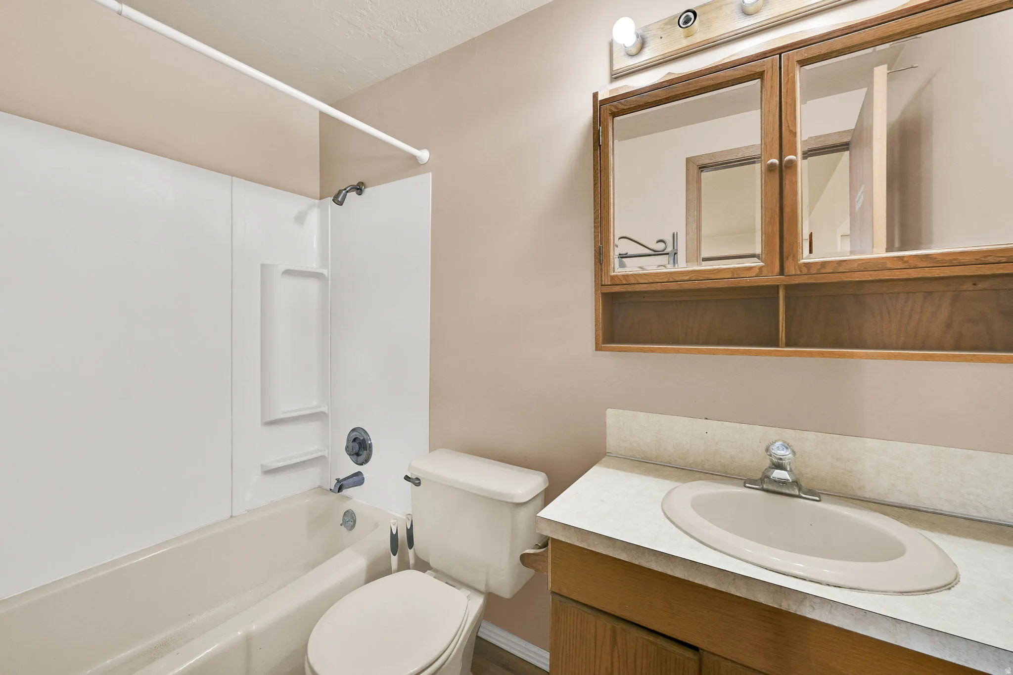 Full bathroom with vanity and bathing tub / shower combination