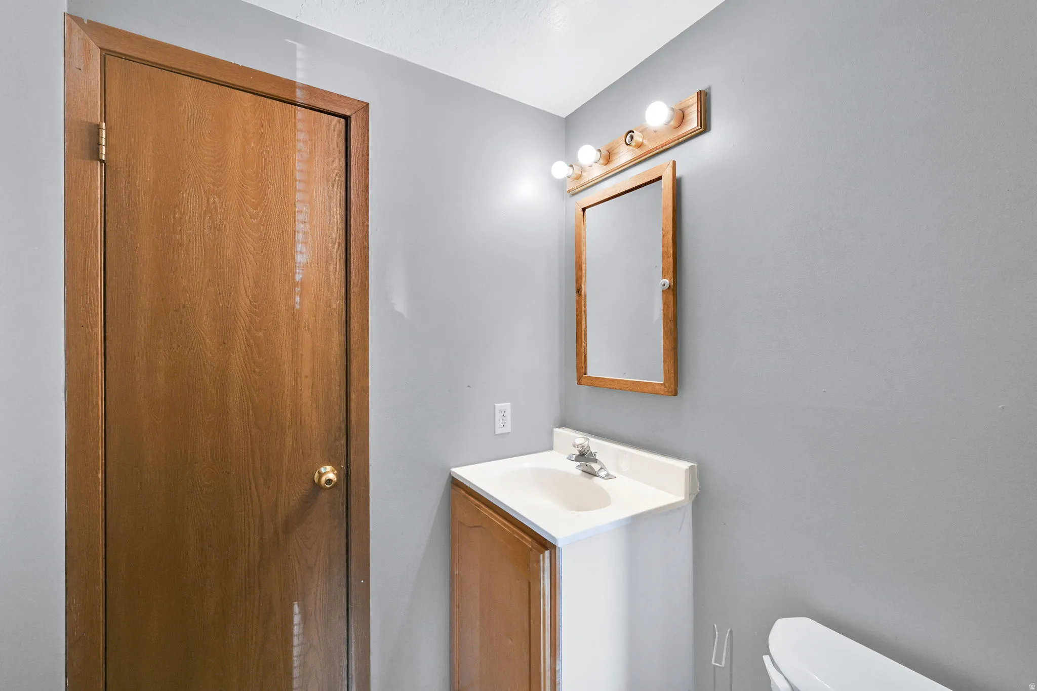 Half bath with toilet and vanity