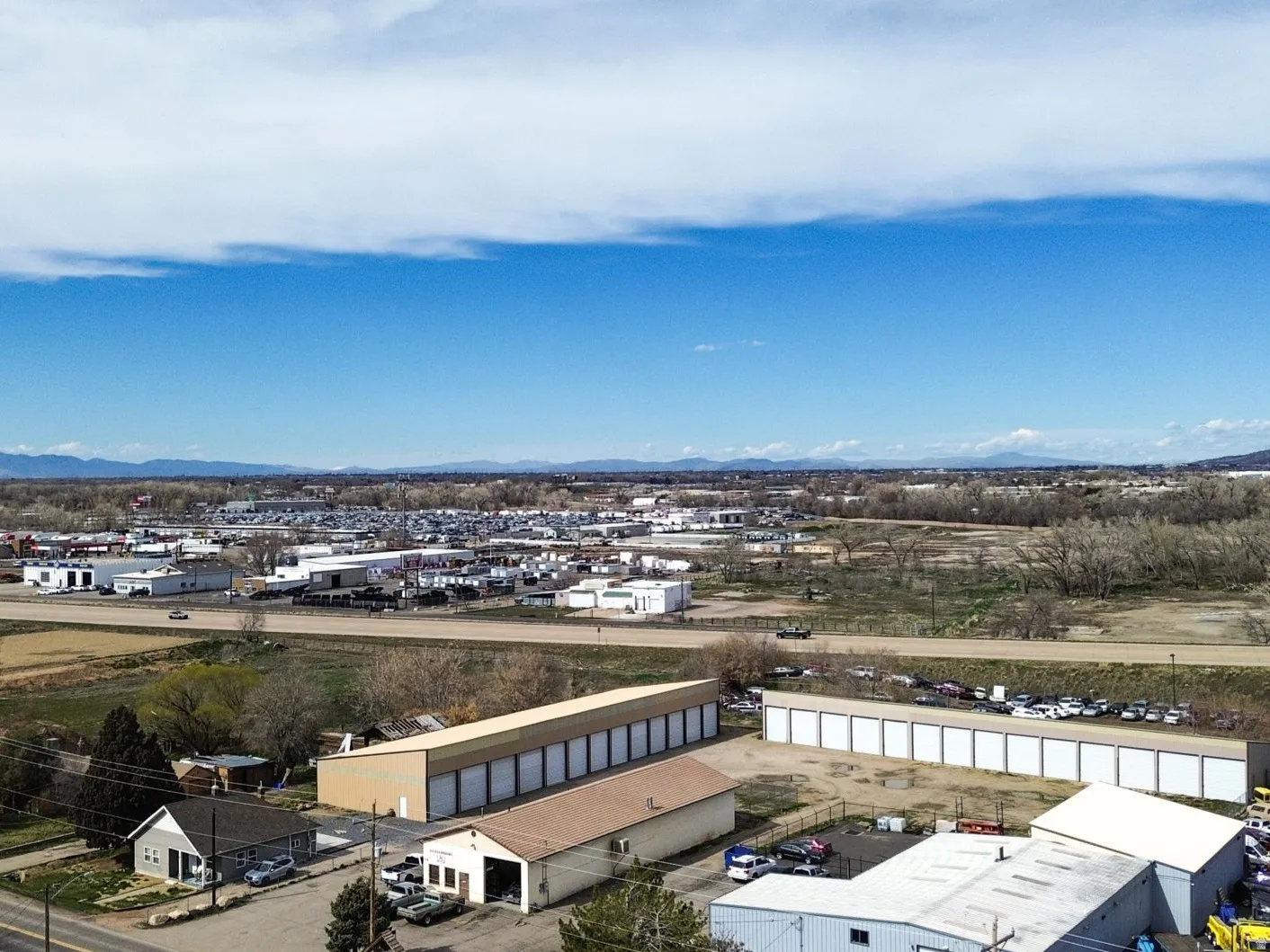 Bird's eye view of a mountainous background and industrial structures
