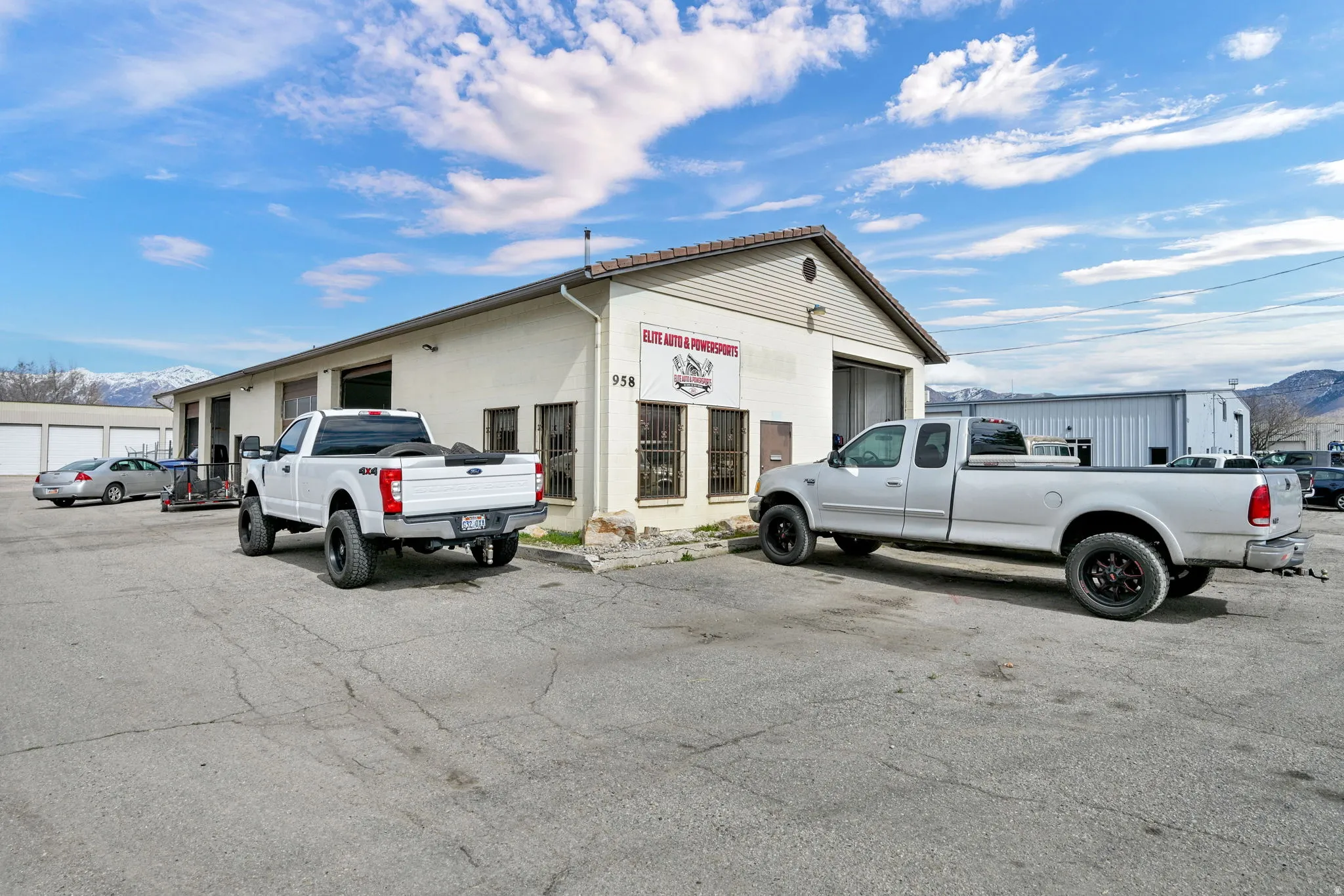 View of property featuring a mountain view and uncovered parking