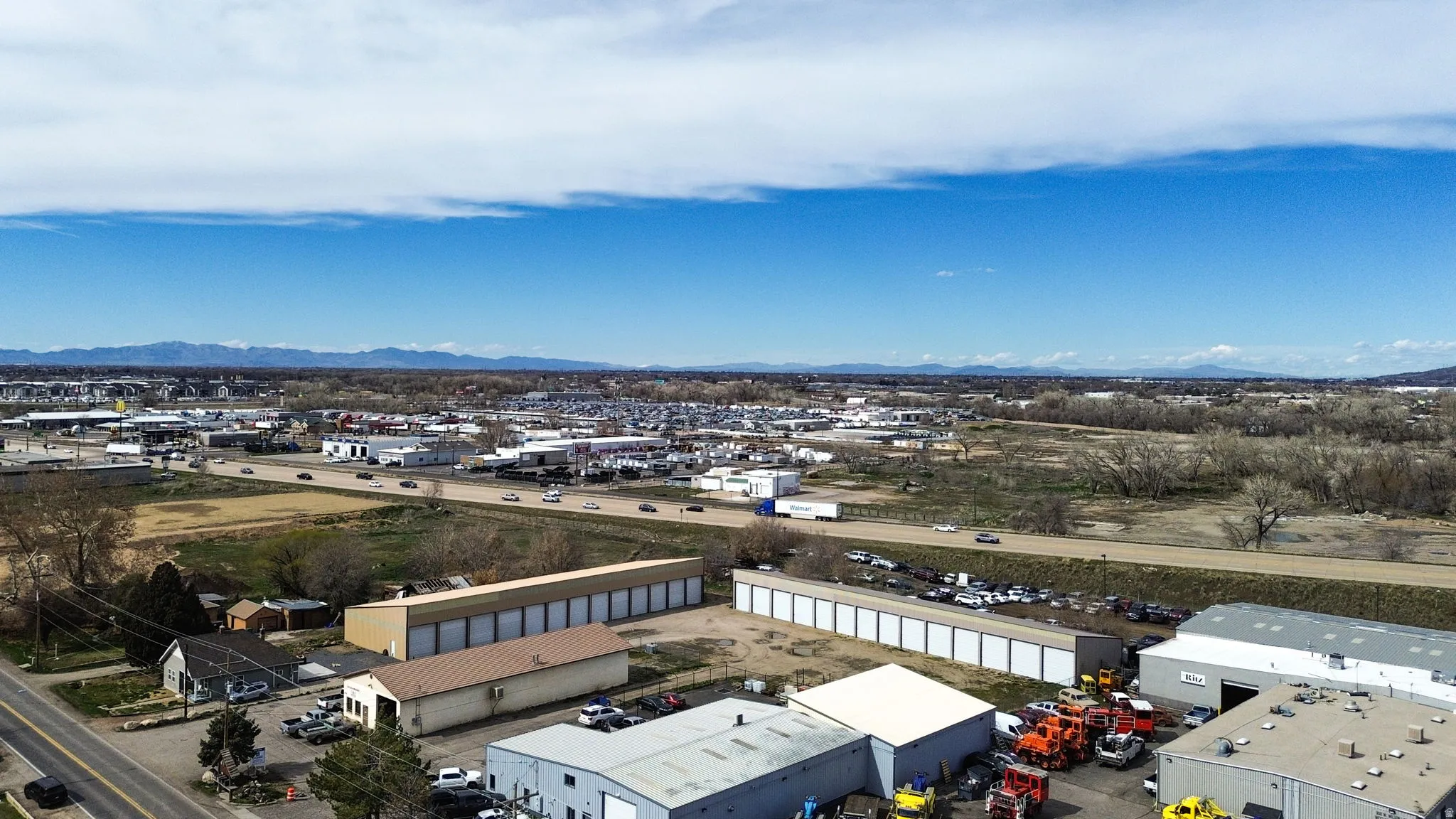 Bird's eye view of a mountainous background and an industrial area