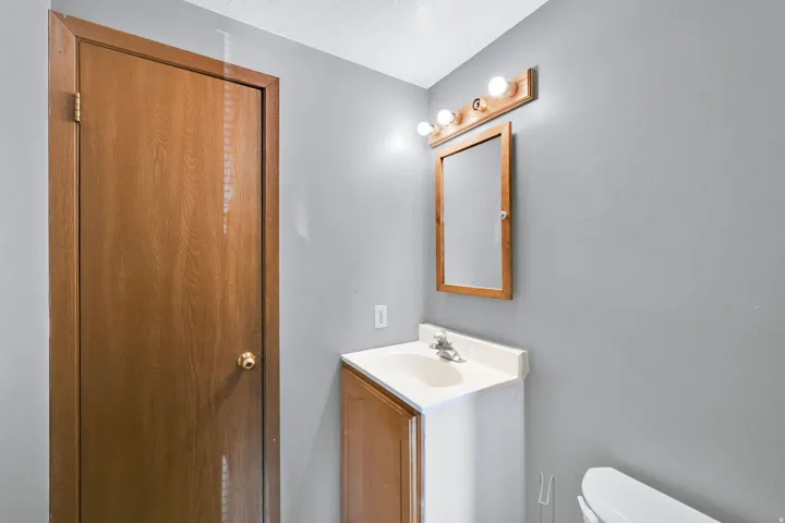 Half bath with toilet and vanity