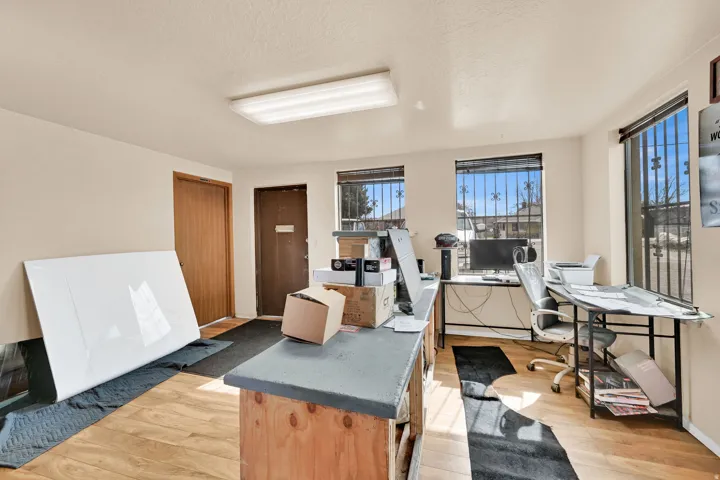 Office area featuring a textured ceiling