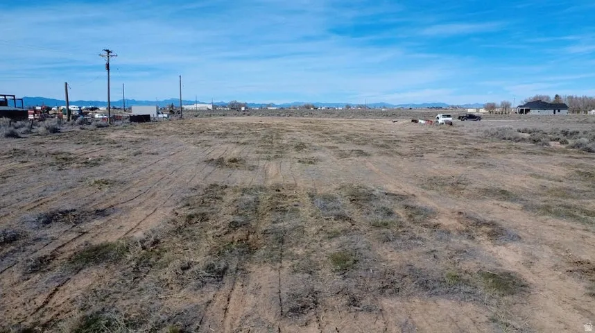 View of yard featuring a rural view and a mountain view