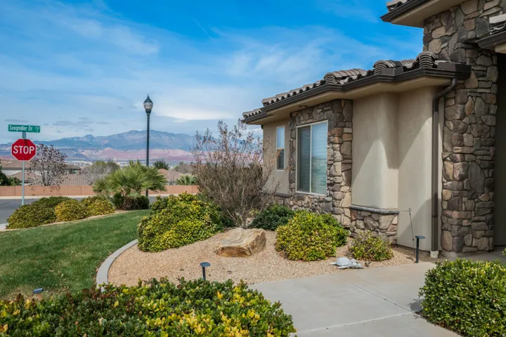 View of grassy yard featuring a mountain view