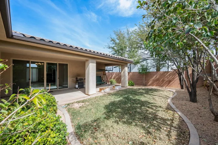 Fenced backyard with a patio area