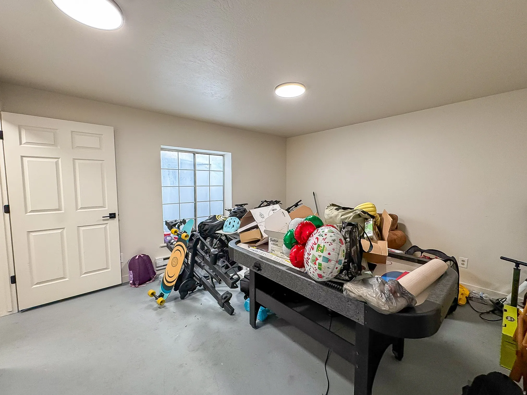 Bedroom featuring finished concrete floors