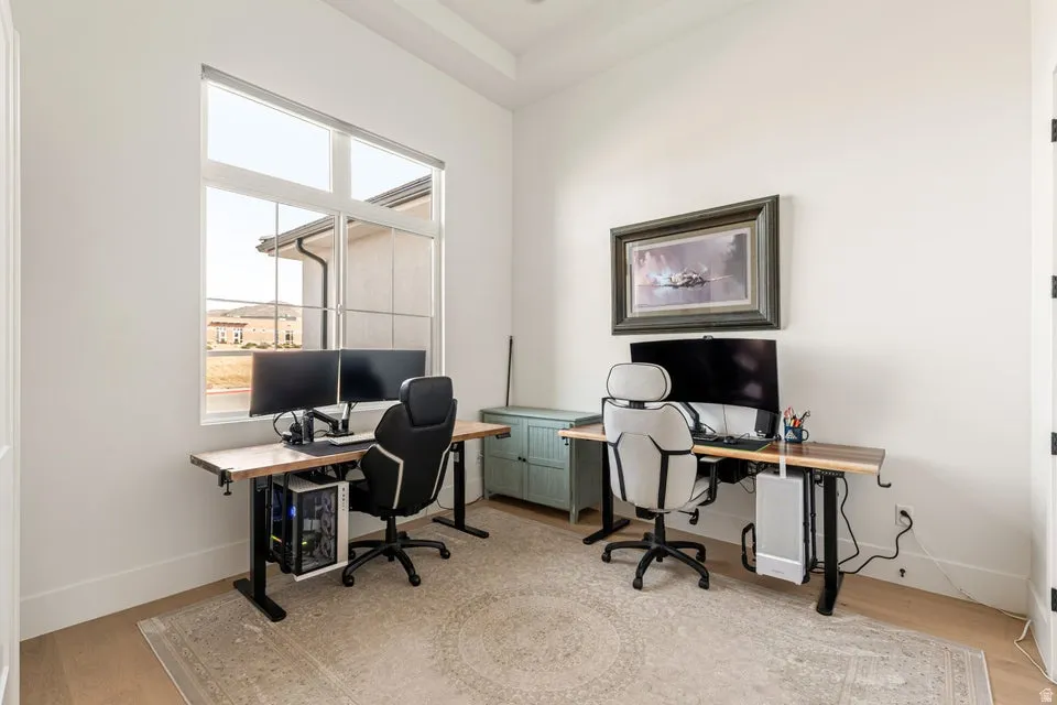 Home office featuring light wood-style floors and baseboards