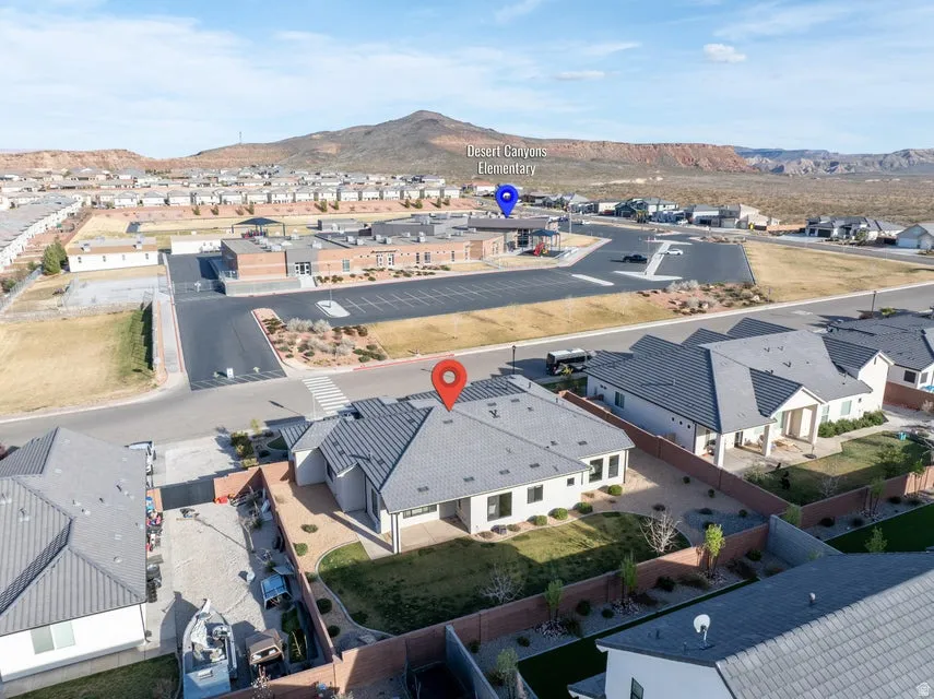 Aerial view of residential area featuring a mountainous background