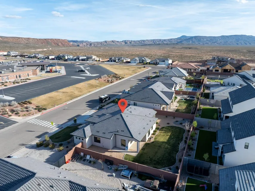 Aerial perspective of suburban area with a mountain backdrop