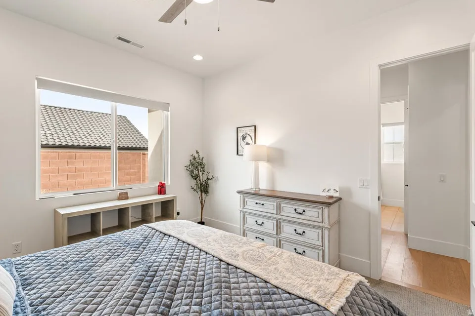 Bedroom featuring ceiling fan, recessed lighting, and light wood-style floors