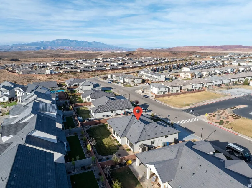 Aerial perspective of suburban area with a mountainous background