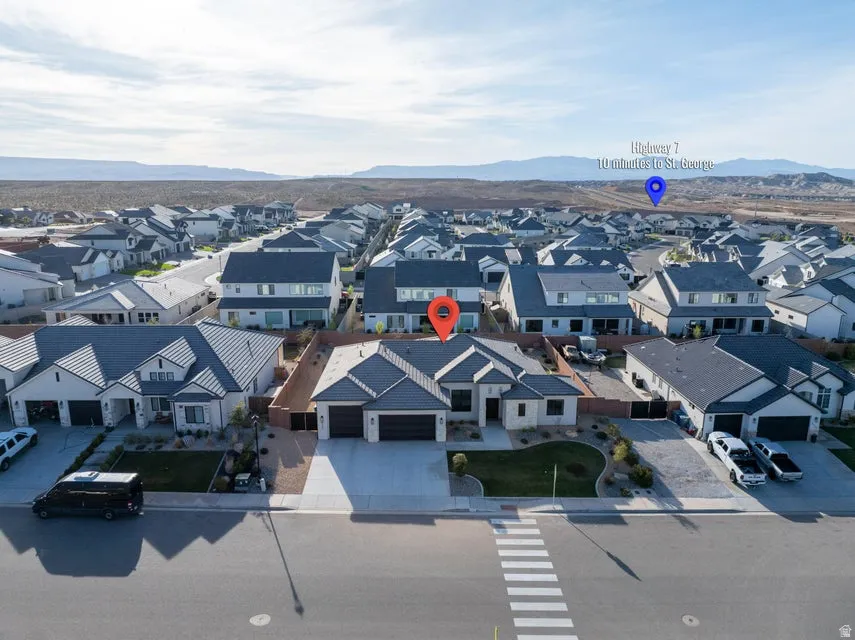 Aerial view of residential area featuring mountains