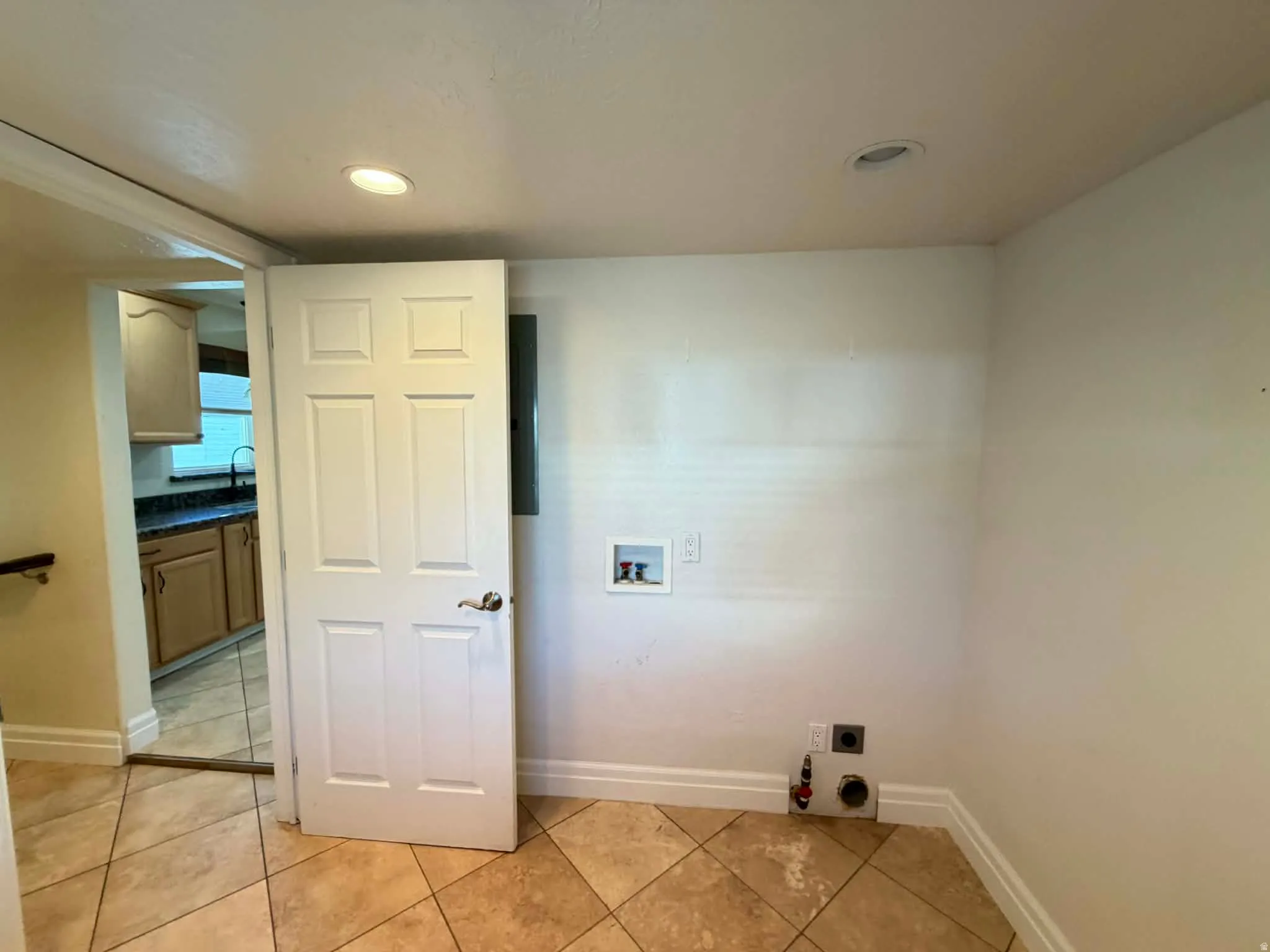 Laundry area with washer hookup, light tile patterned floors, recessed lighting, and electric dryer hookup