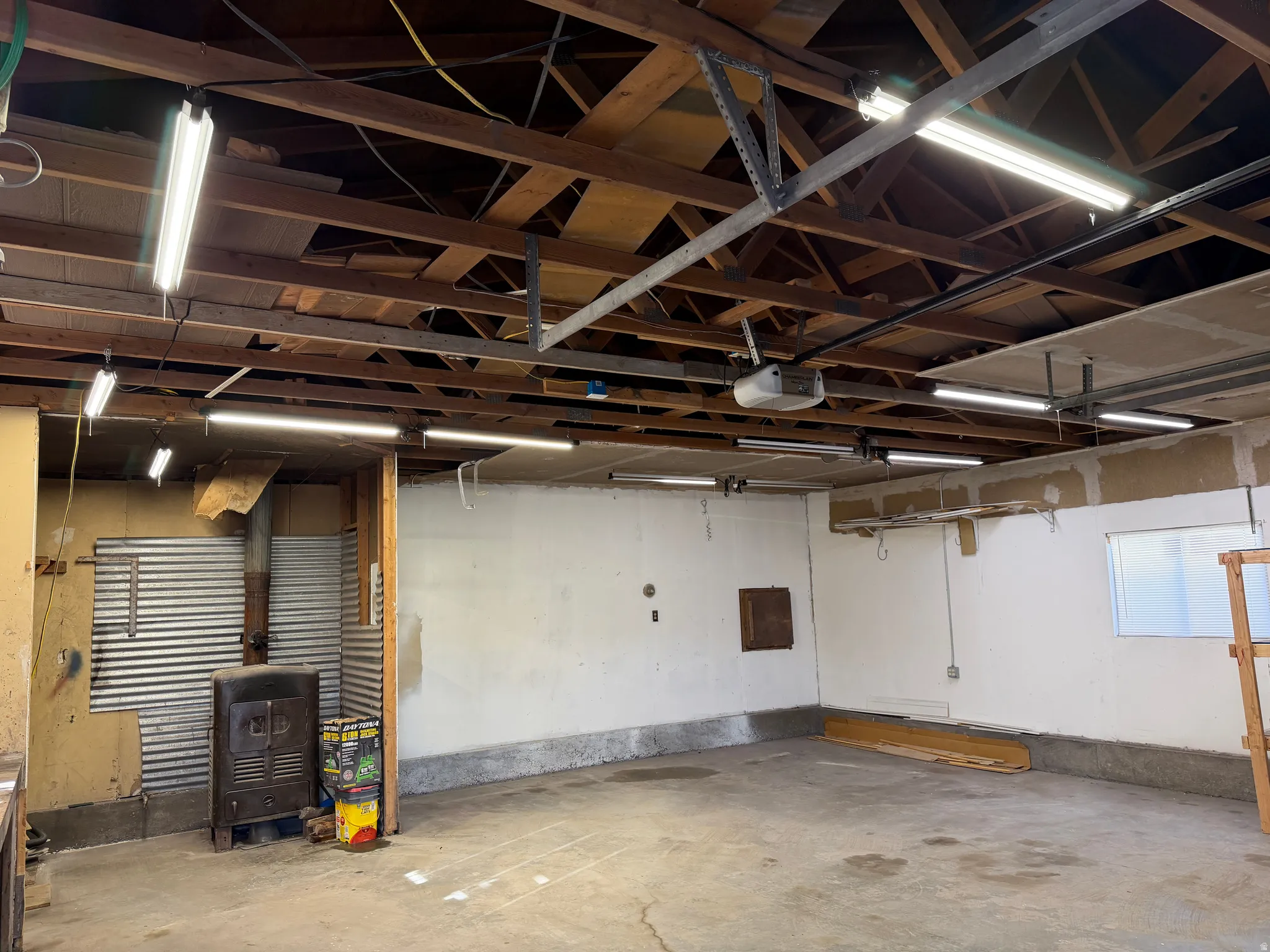 Garage featuring a garage door opener