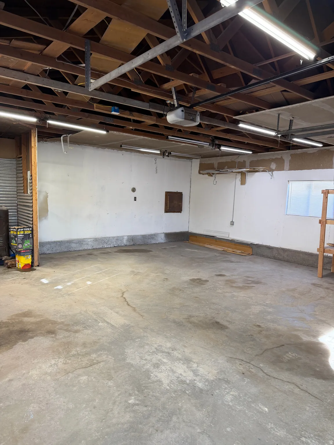 Garage featuring a garage door opener