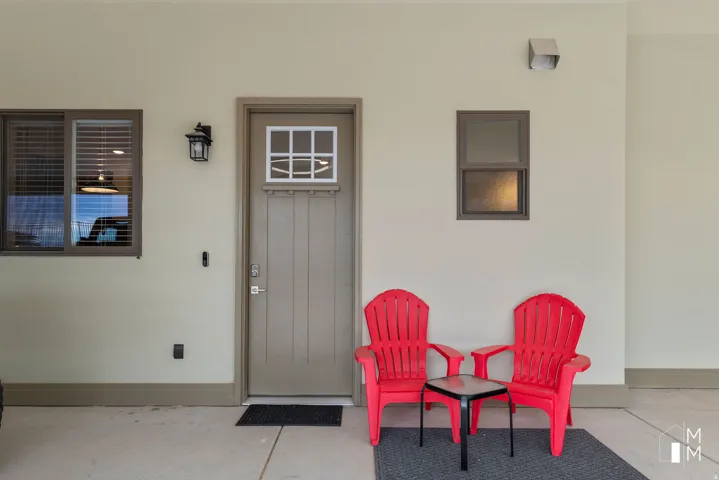 View of exterior entry with stucco siding