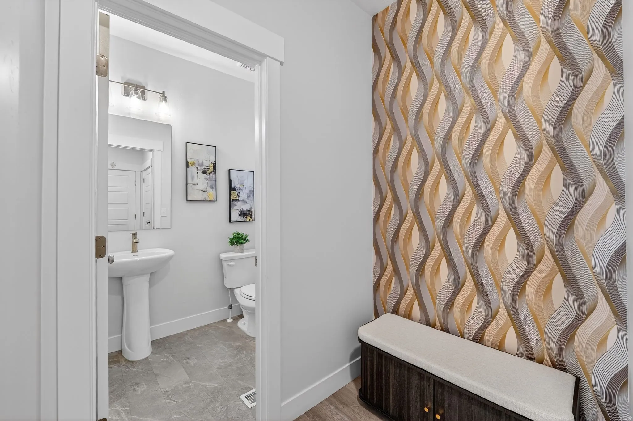 Bathroom featuring toilet and baseboards