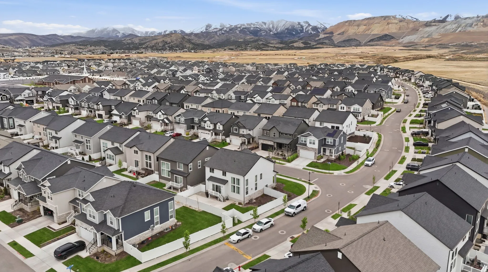 View of property location with a mountain backdrop and nearby suburban area