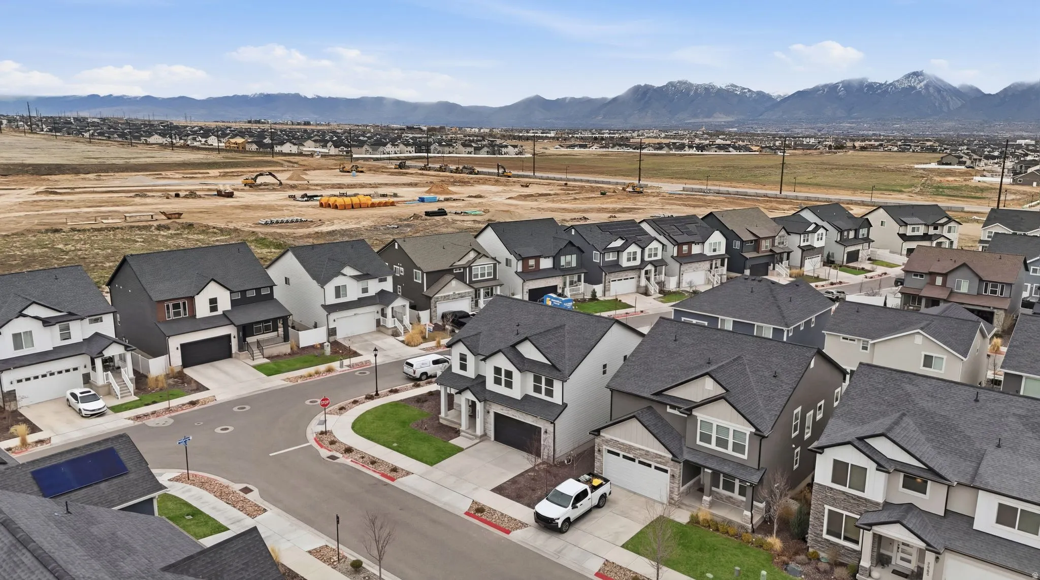 Aerial view of residential area with a mountainous background
