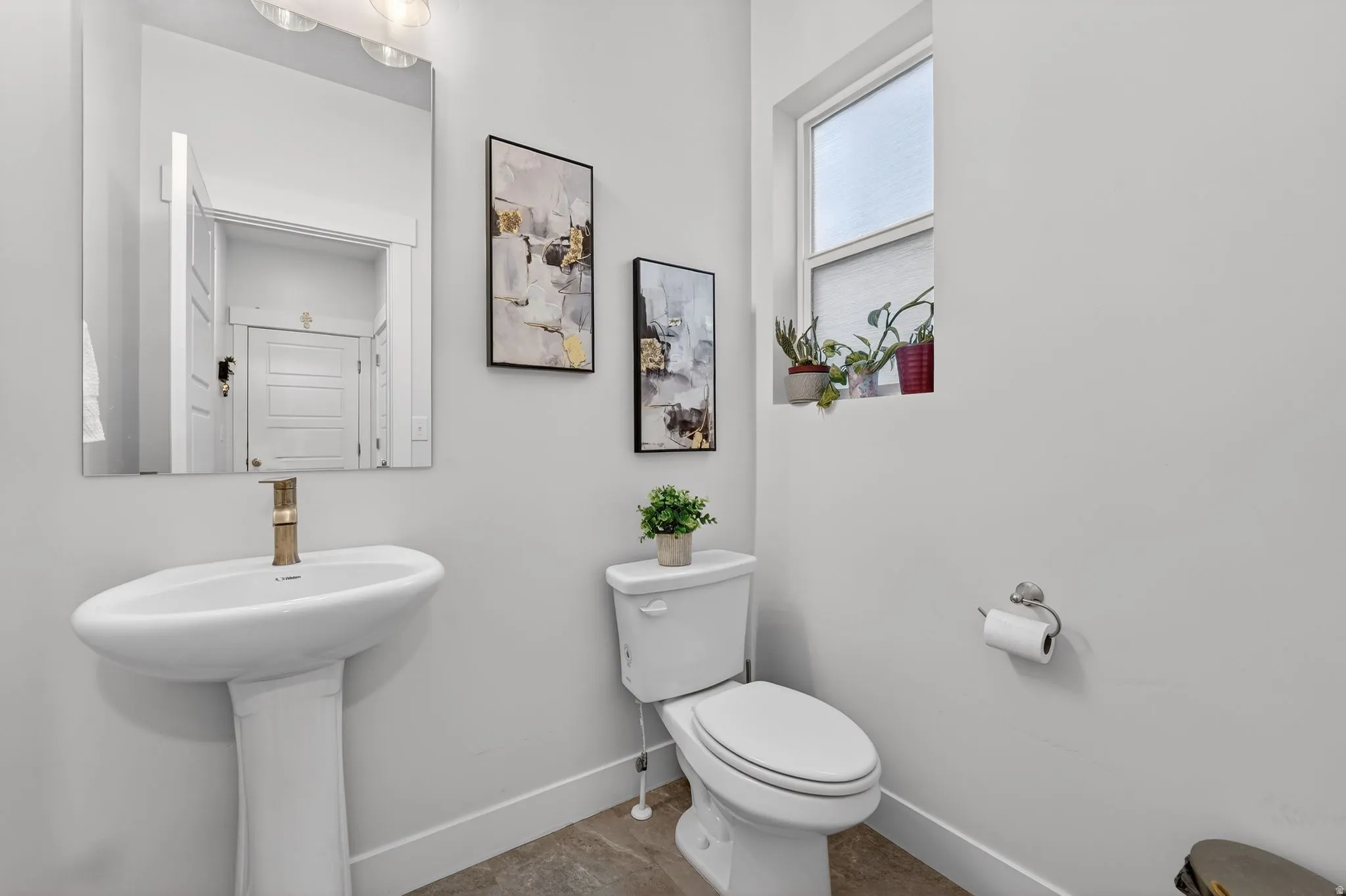 Bathroom featuring toilet and baseboards