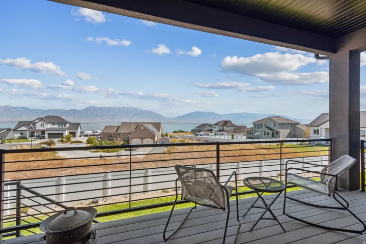 Balcony featuring a residential view and a mountain view