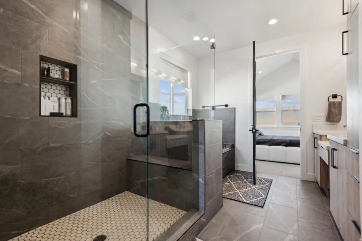 Ensuite bathroom with vanity, a stall shower, recessed lighting, and light tile patterned flooring