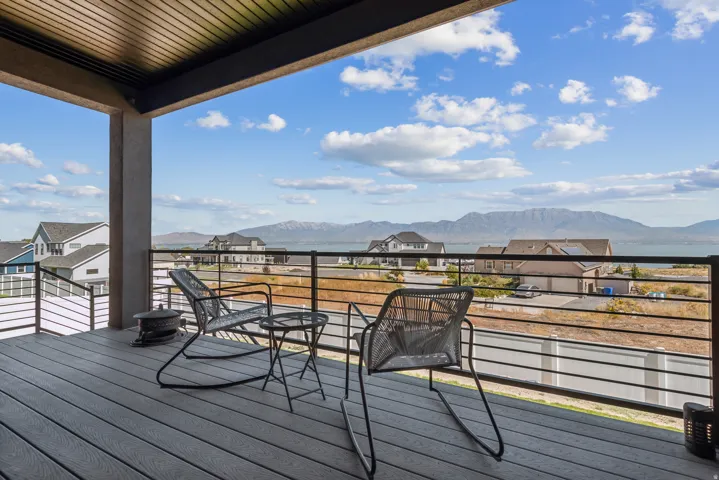 Deck with a mountain view and a residential view