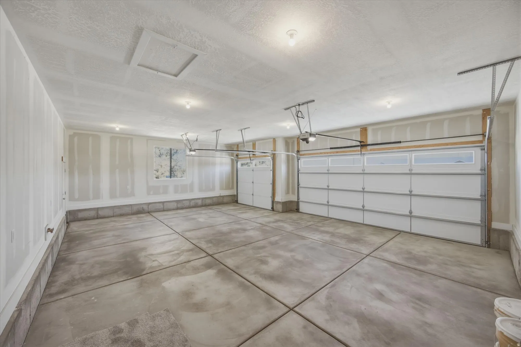 Interior view of 3-car garage with mandoor