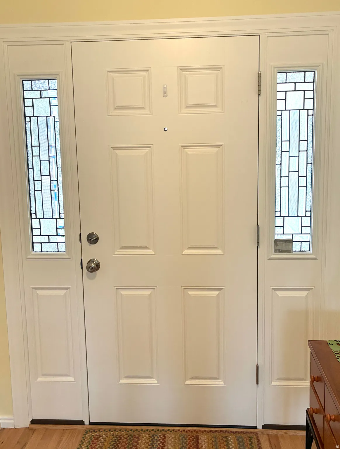 Doorway to outside with wood finished floors