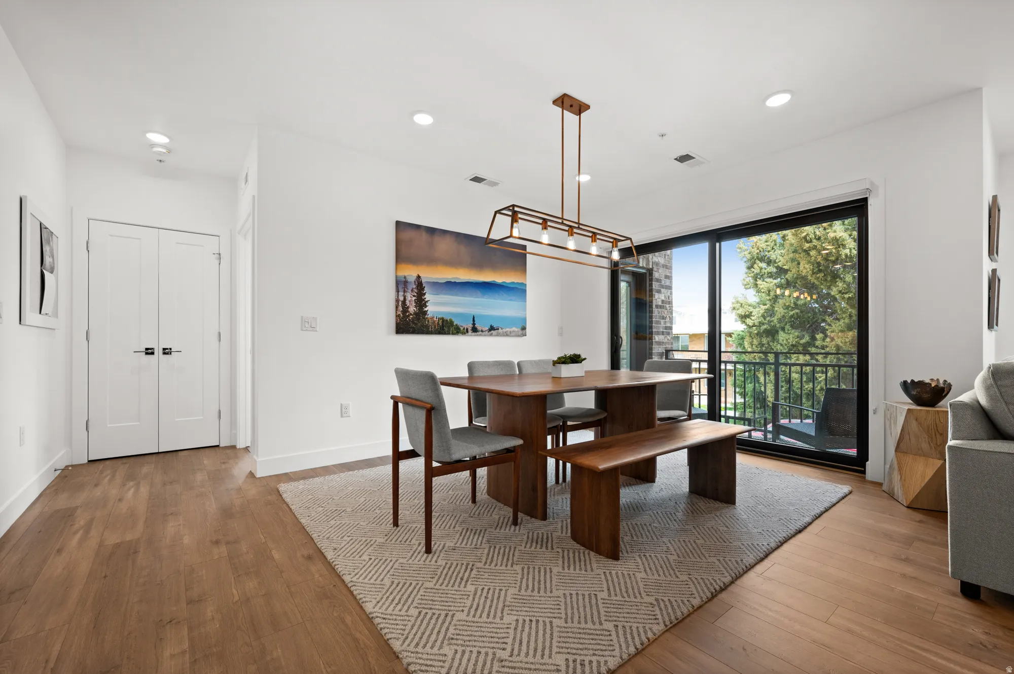 Dining room featuring light wood-type flooring and recessed lighting