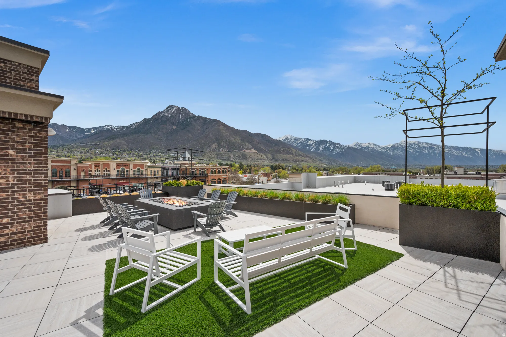 View of patio / terrace with an outdoor fire pit and a mountain view