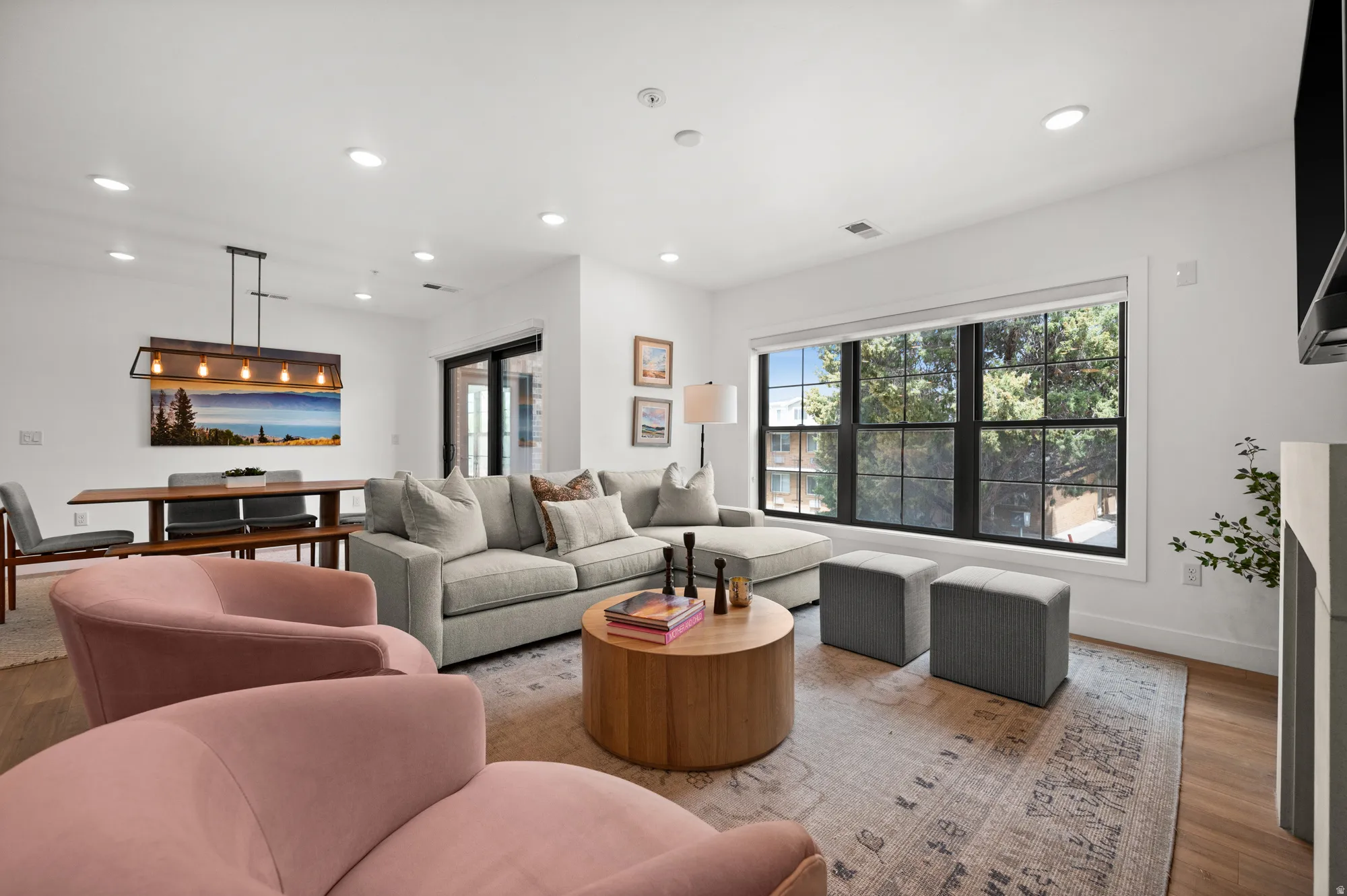 Living room featuring wood finished floors and recessed lighting