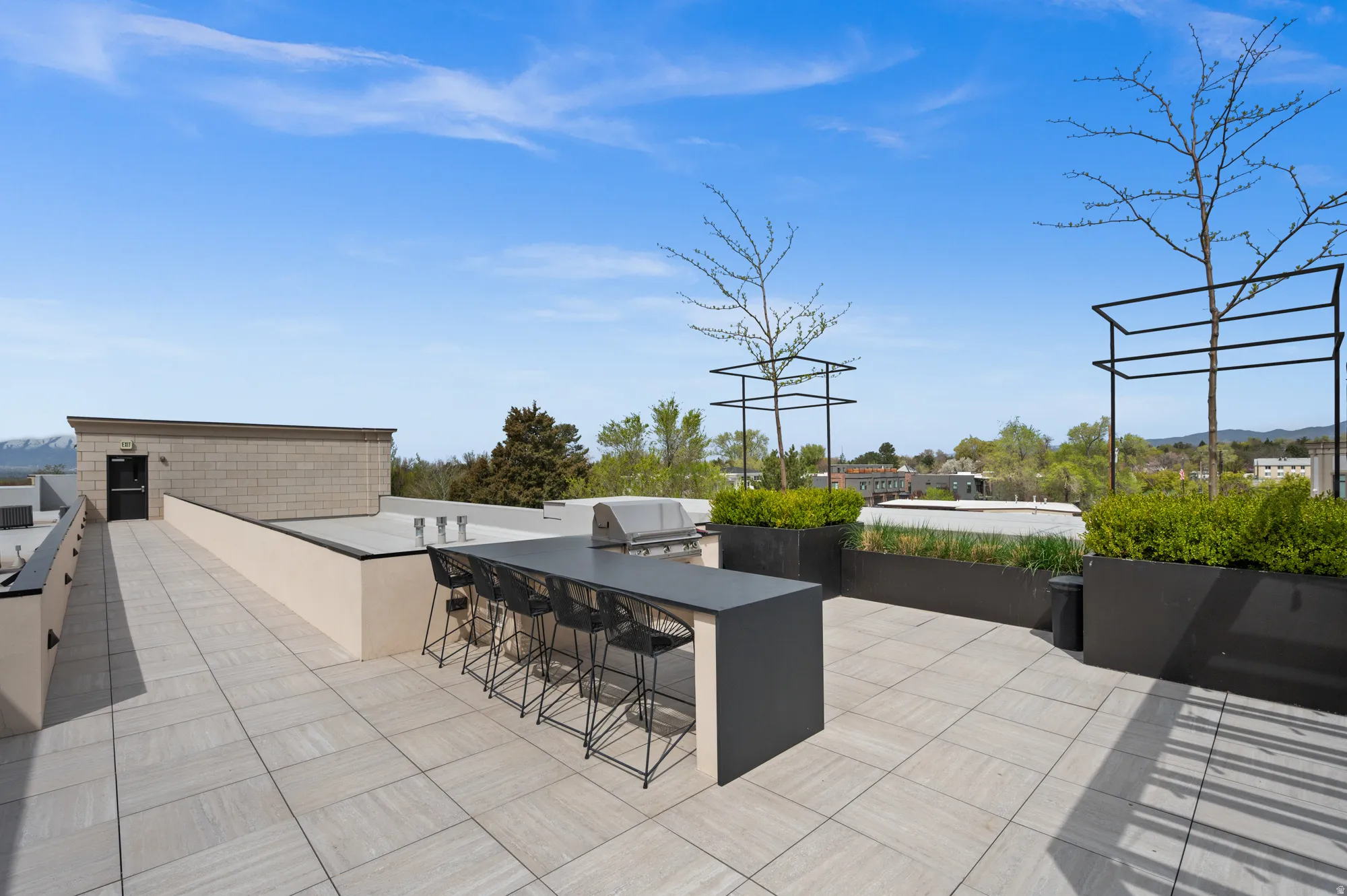 View of patio / terrace with an outdoor kitchen and a mountain view