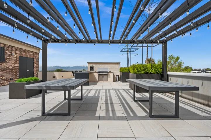 View of patio featuring an outdoor kitchen / dining area and a mountain view