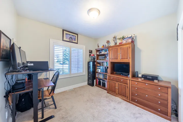 Room featuring wall-to-wall carpeting and neutral wall paint