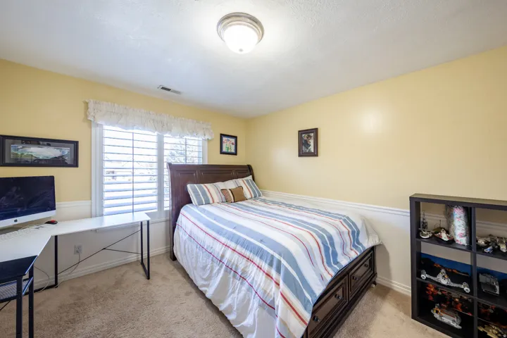 Bright room with warm yellow walls and white wainscoting